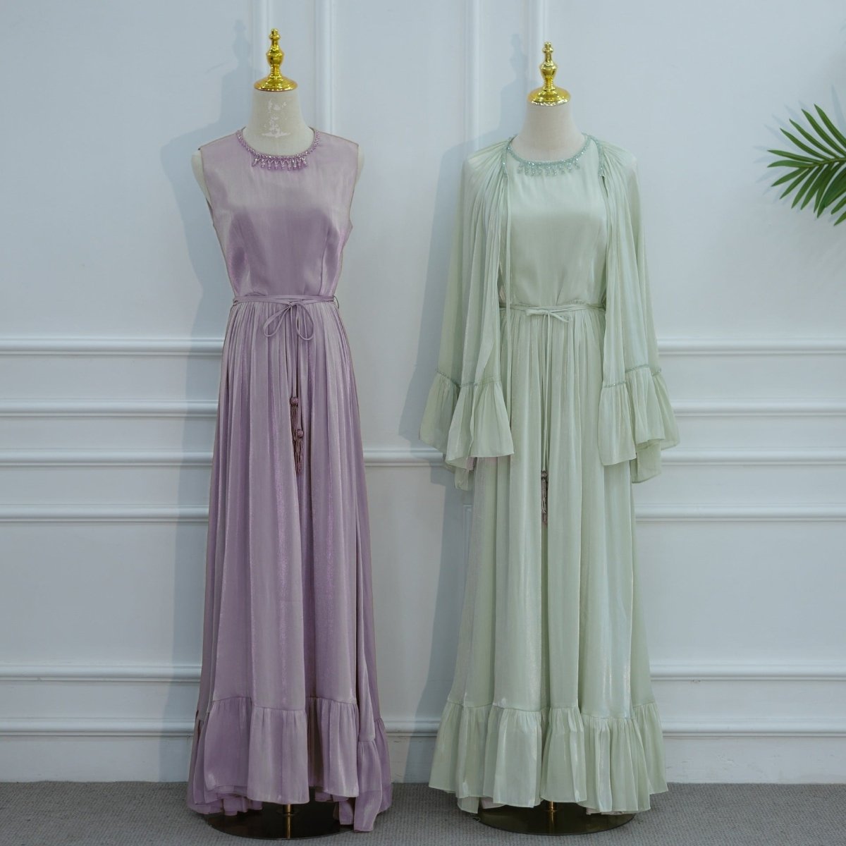 Full-length front view of inner sleeveless pleated maxi dress worn alone