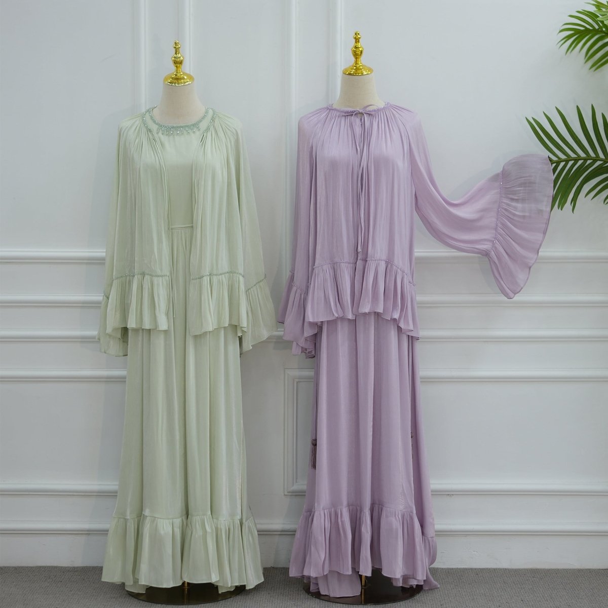 Gathered open-front neckline of the ruffle cape draping softly from the shoulders