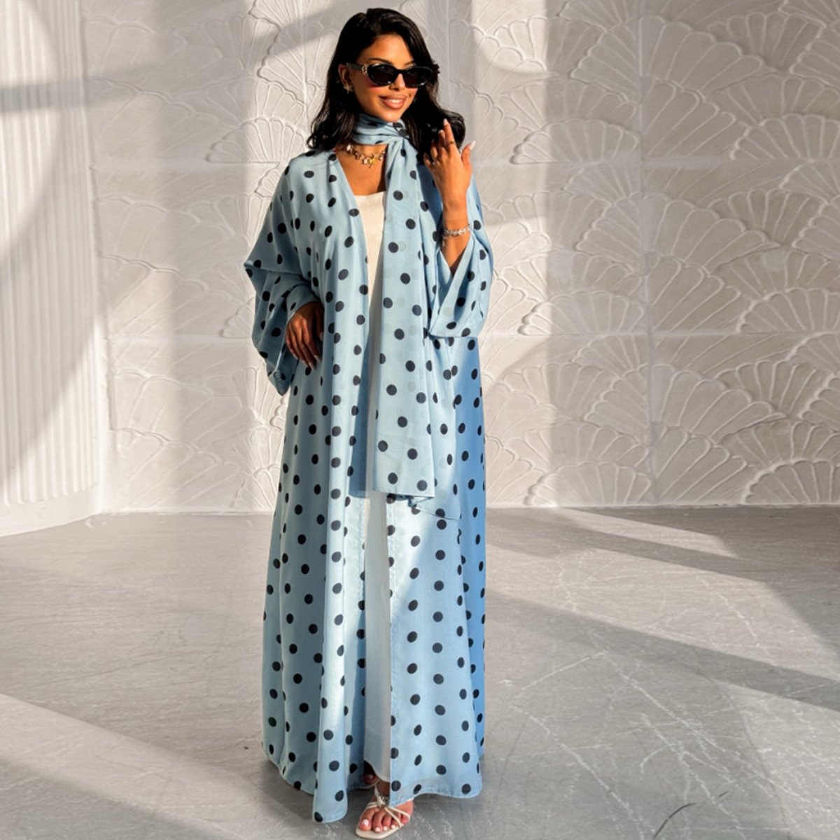 3/4 angle view of polka dot crepe abaya set on model