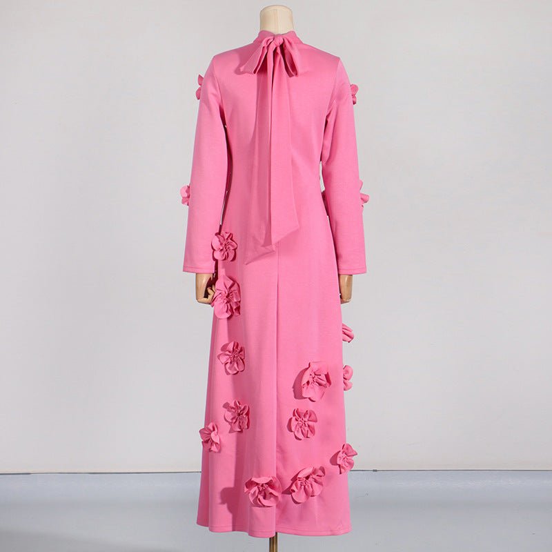 Side view highlighting asymmetric floral appliqué detail down the skirt