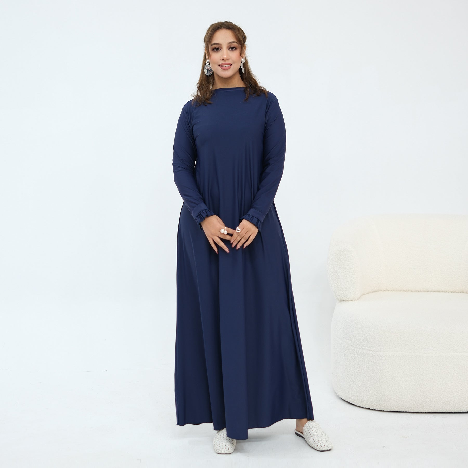Back view of long-sleeve swim dress with full-length swim pants