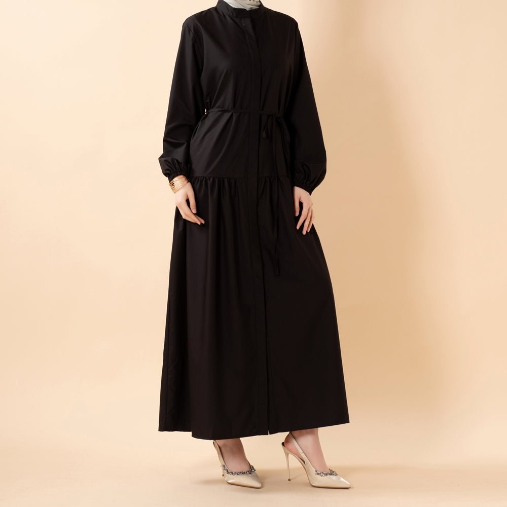 Flowing A-line silhouette of modest shirt dress from below