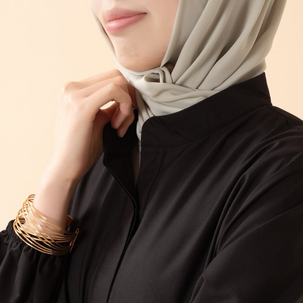 Elegant trench-inspired abaya worn with matching hijab