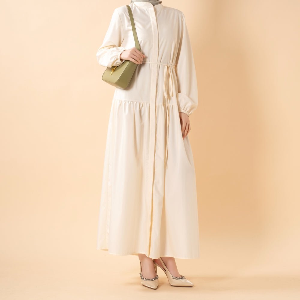Model wearing A-line trench abaya styled for workwear
