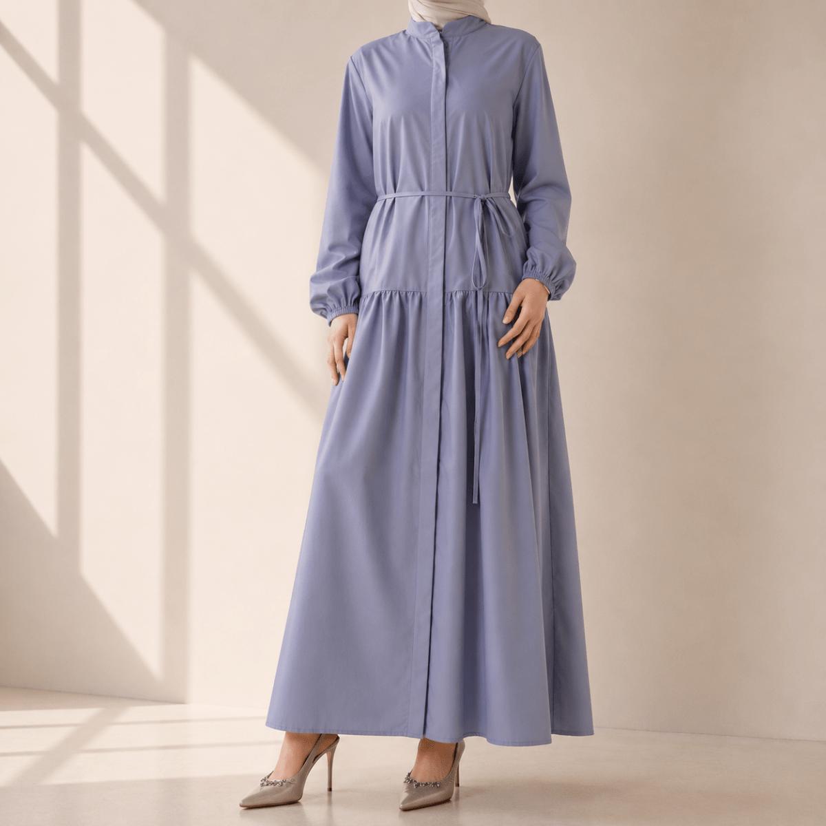 Front view of closed abaya maxi dress with self-tie belt