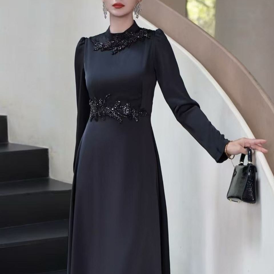 Full-length view of flowing A-line maxi skirt with sheer chiffon sleeve overlay