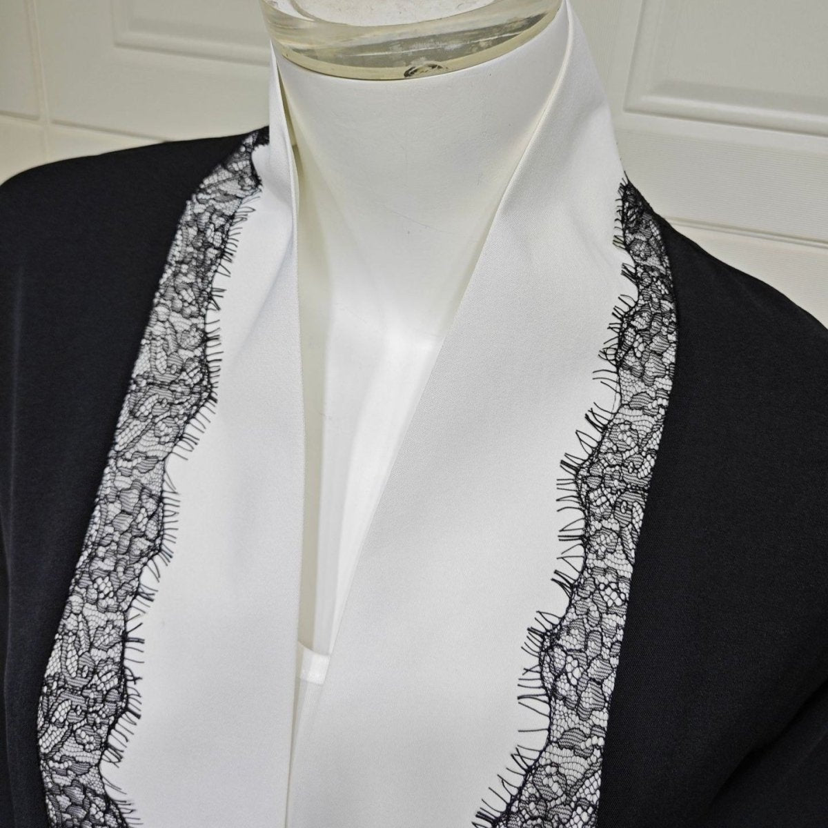 Back view of fluid black open abaya with wide sleeves and open-front drape
