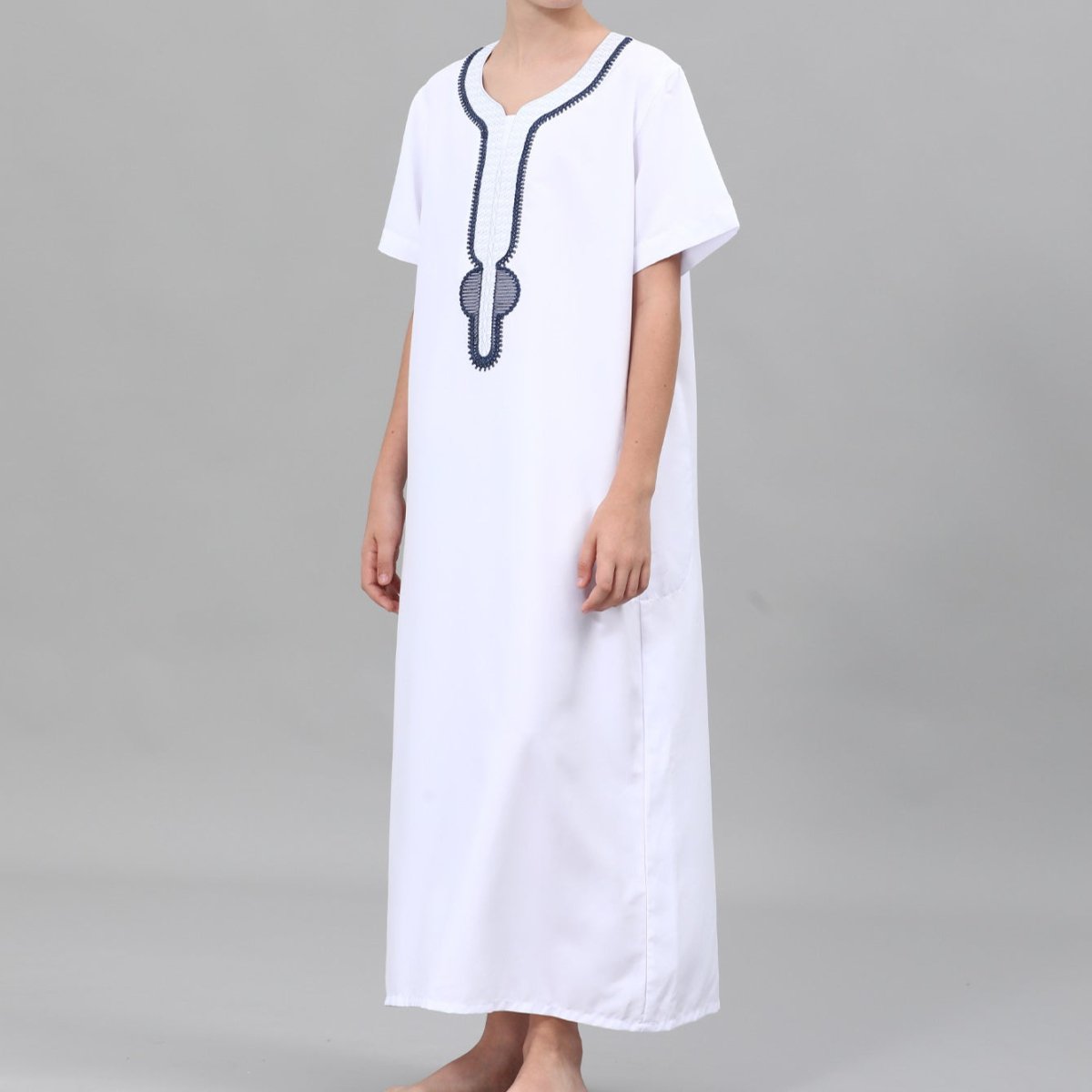 Boys' cream thobe with gold embroidery worn for special occasion