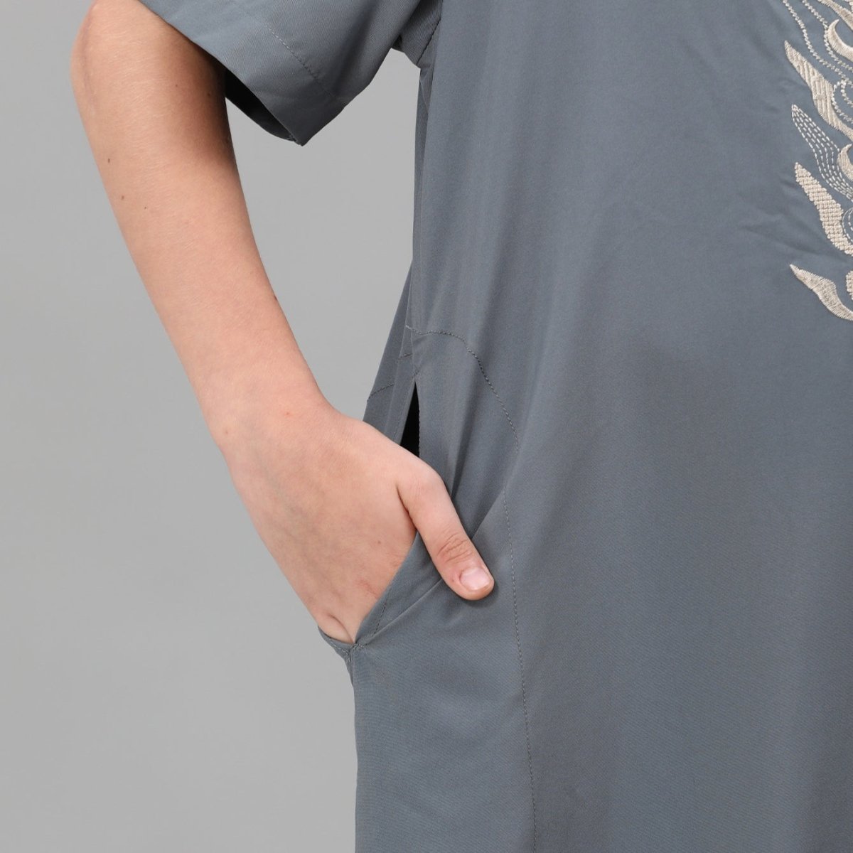 Boys' embroidered thobe flat lay showing multiple colourways