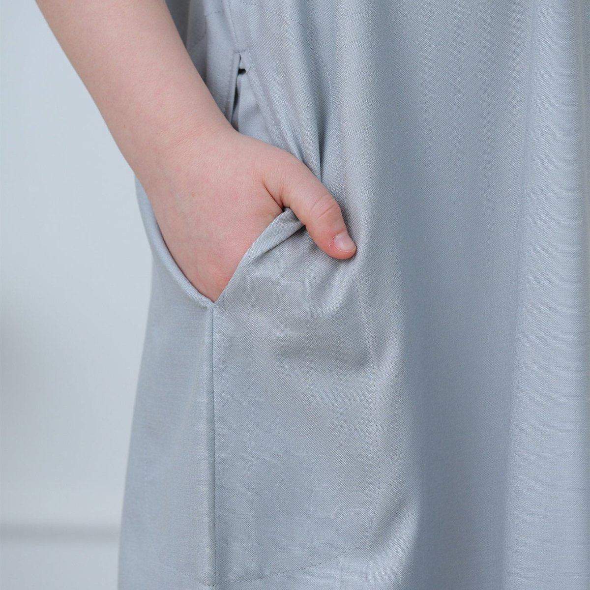 Full-length relaxed straight-cut silhouette of boys' contrast stitching thobe in powder blue