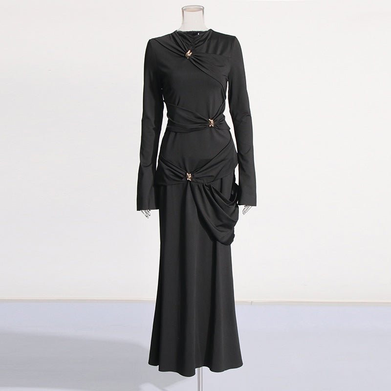 Crystal brooch at hip of asymmetric draped evening gown
