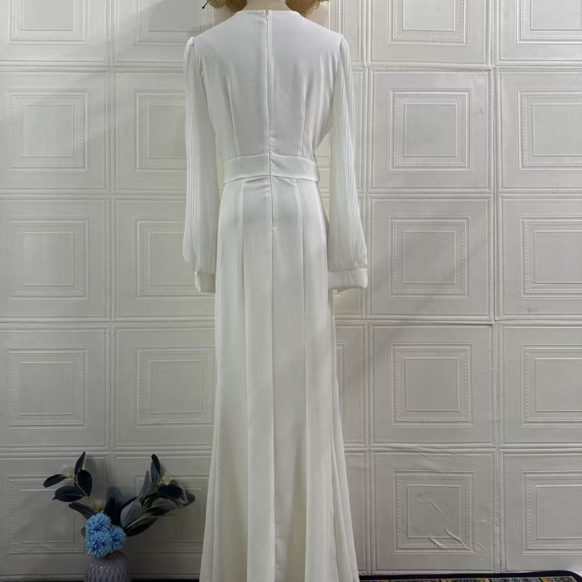 Sheer pleated chiffon sleeves with elasticated cuffs detail on satin gown