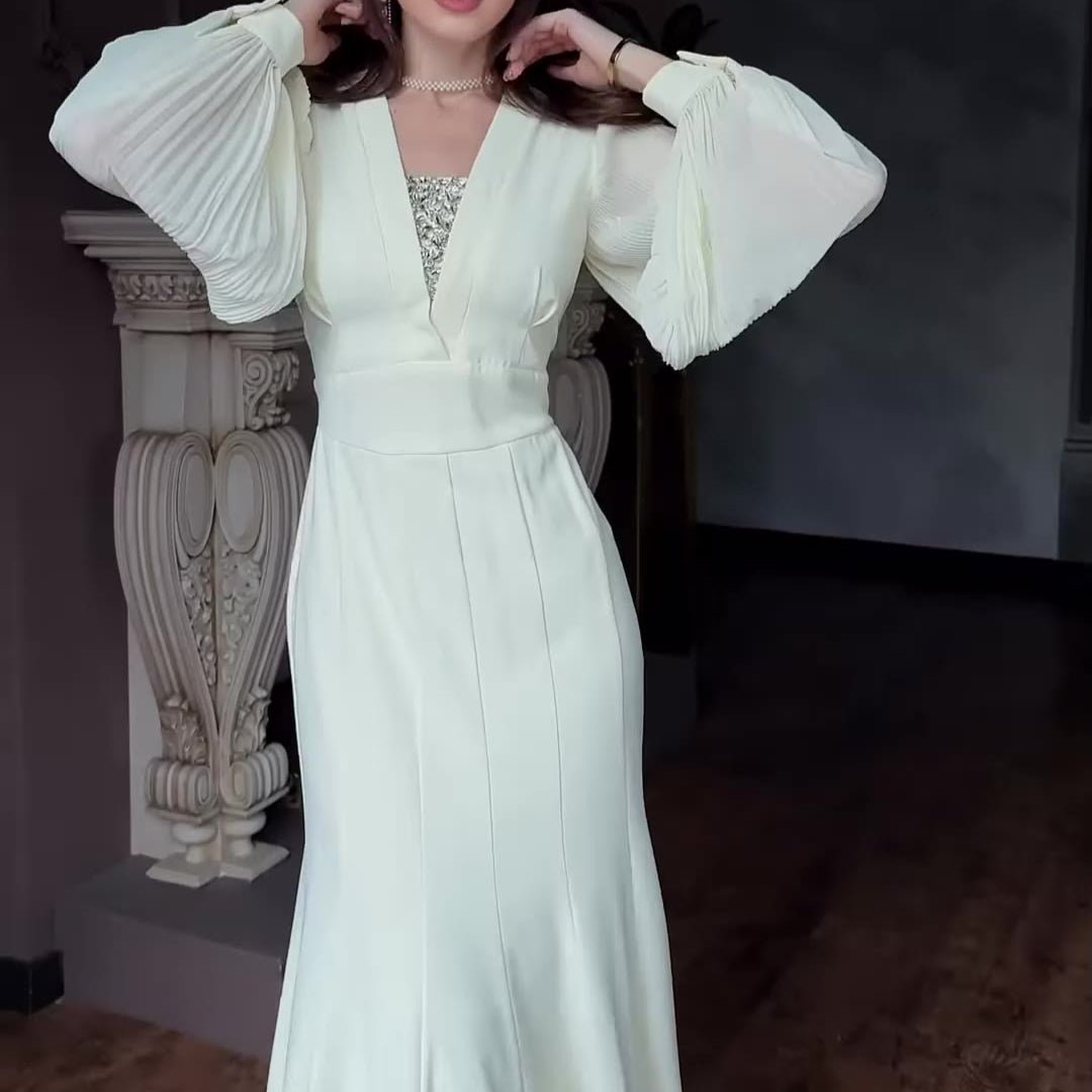 Close-up of satin fabric sheen on elegant empire waist gown