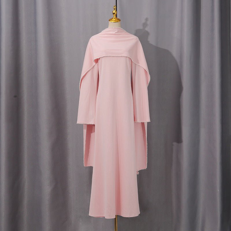 Full-length fitted bodice detail of blush pink cape sleeve evening dress