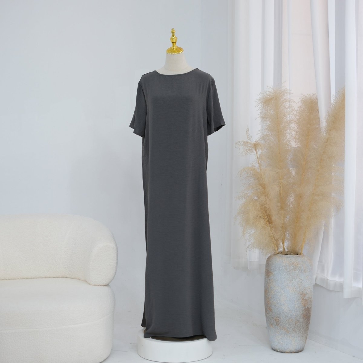 Full-length view of the white minimalist crinkle inner dress
