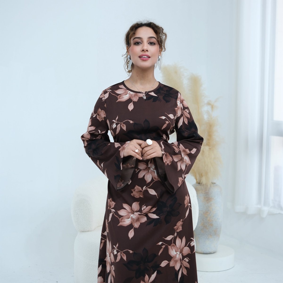 Front view of ink-wash magnolia print satin maxi dress with waist belt