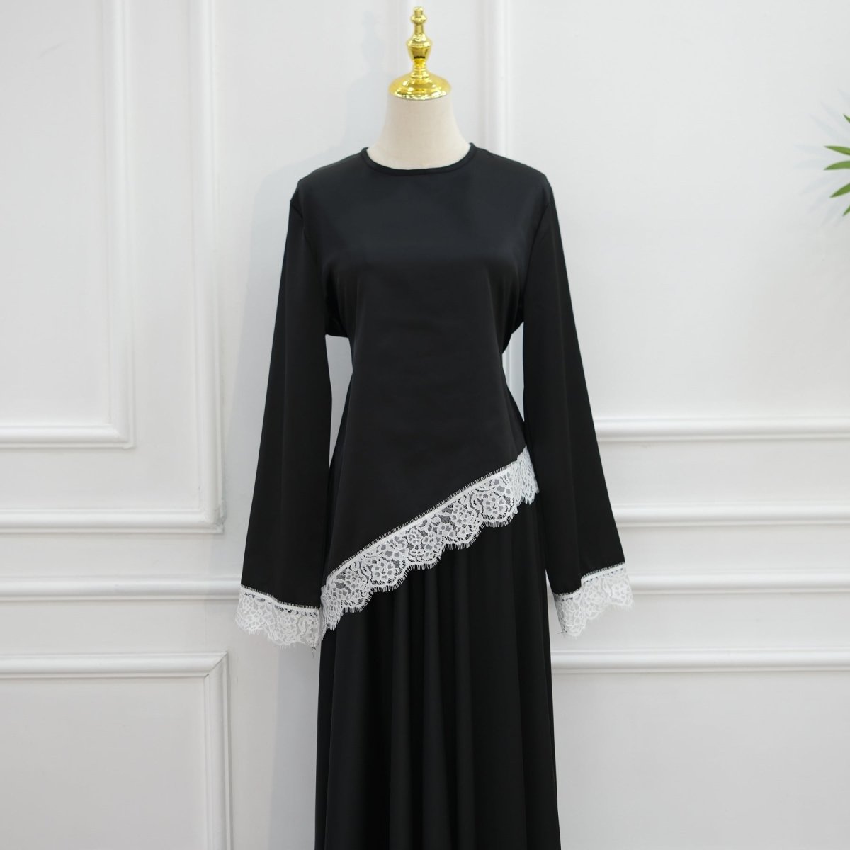 Bell sleeve movement close-up on contrast panel satin top