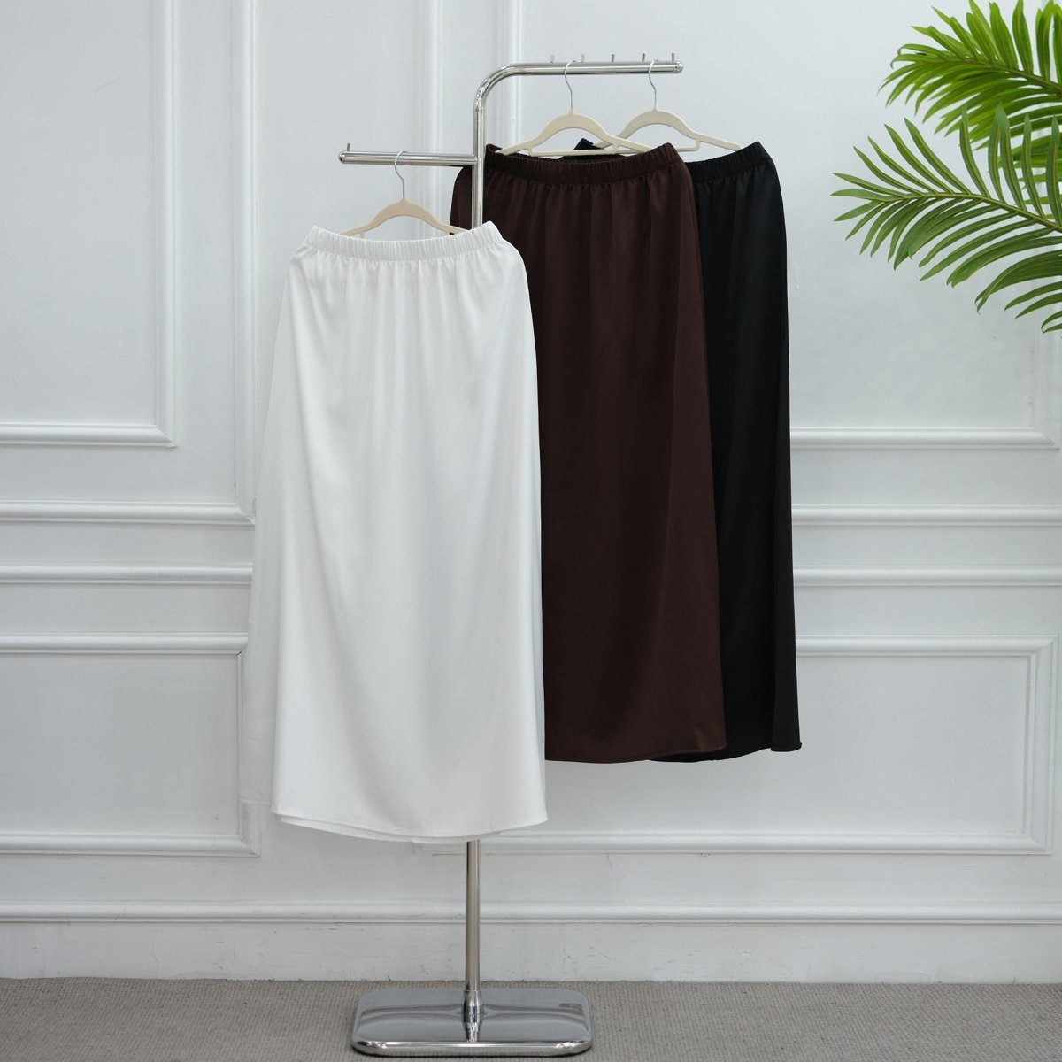 Back diagonal lace panel revealed on chocolate satin top