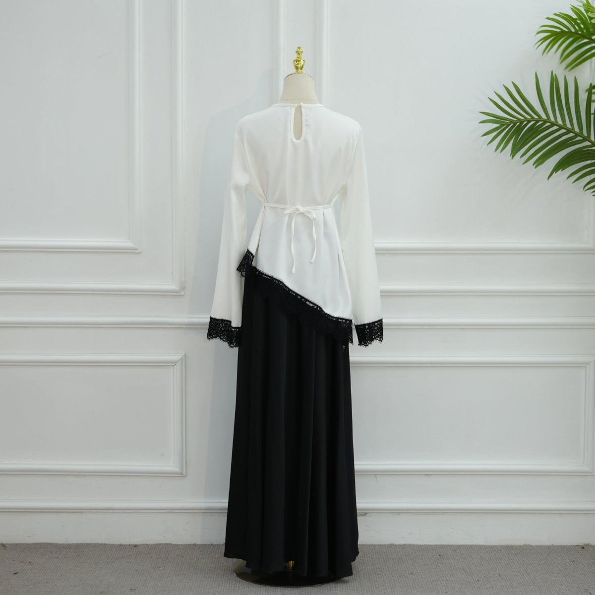 Full-length front view of contrast panel satin top in black colourway