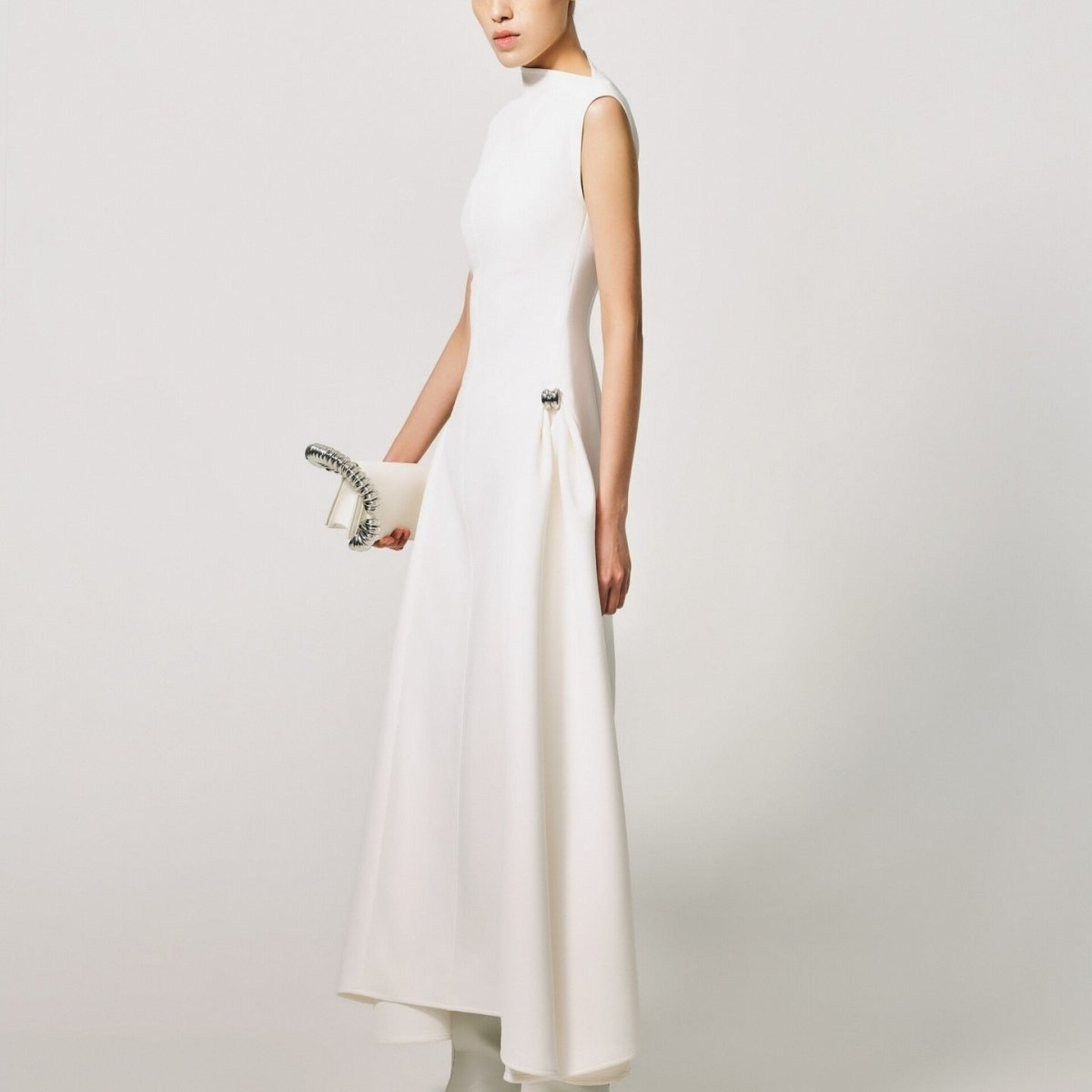 Minimalist modest fitted dress in black with elegant proportions