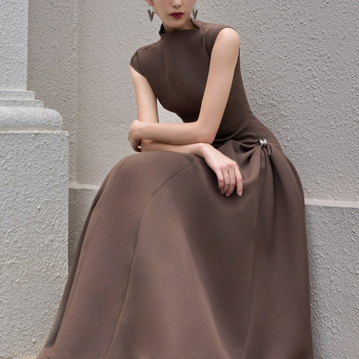 Minimalist black maxi dress with fitted bodice and floor-length skirt