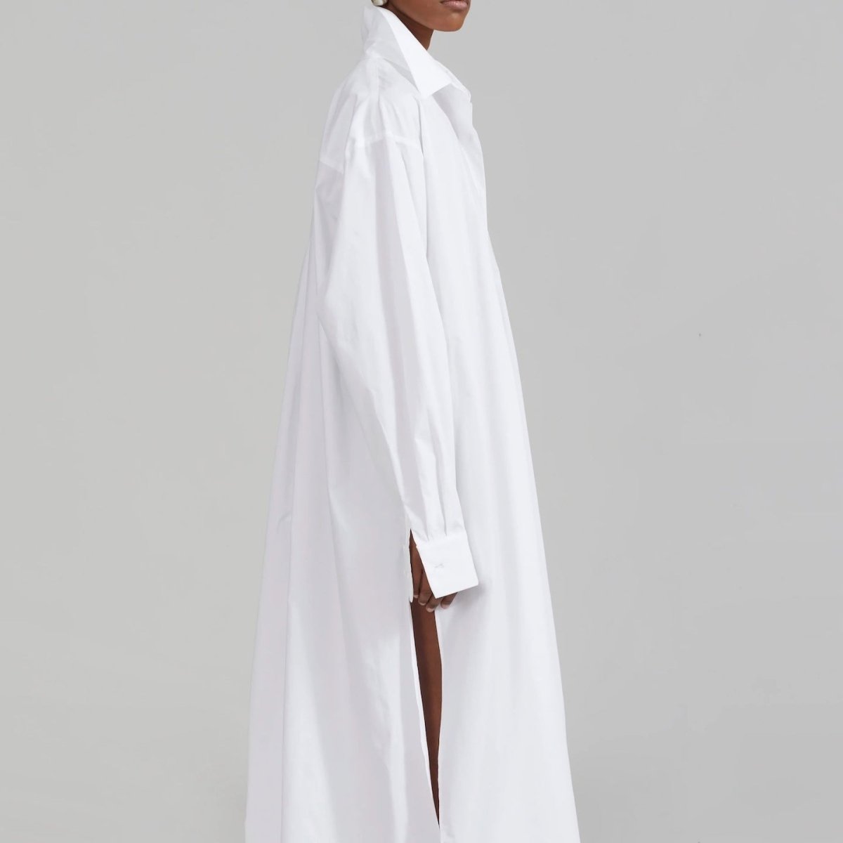 White shirt abaya with chest pocket styled for travel