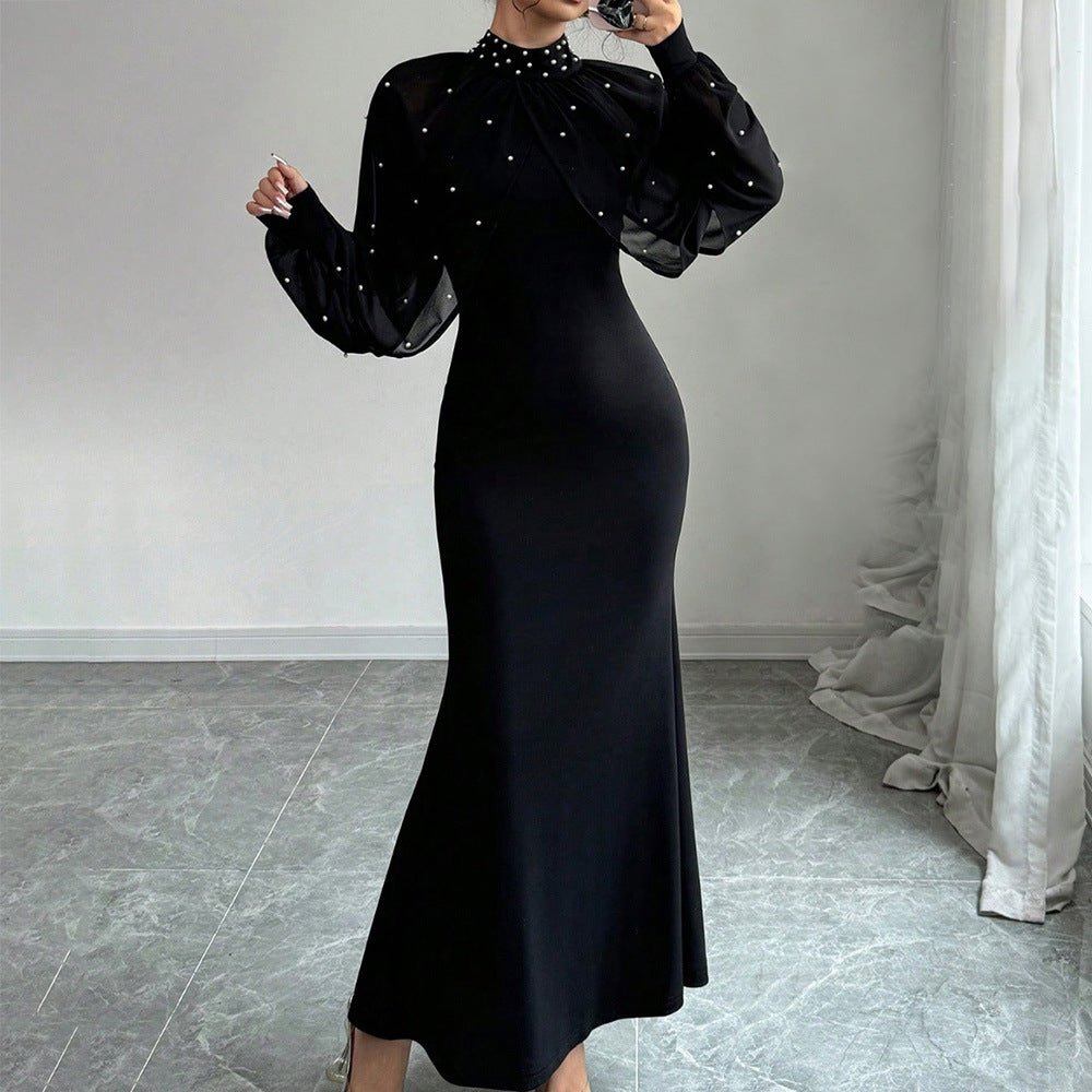 Mock neckline detail with scattered pearl studs on black bodycon gown