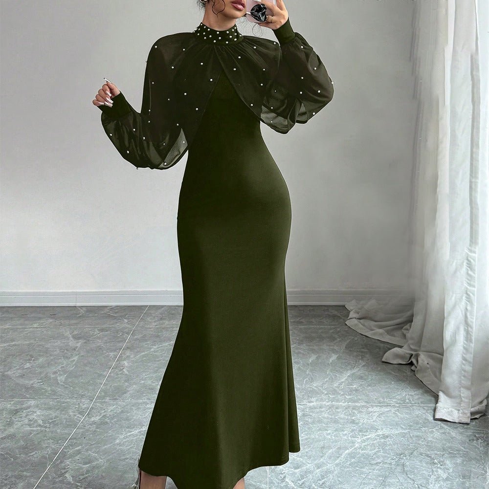 Contrast of opaque black bodycon body against ethereal pearl-covered sleeves