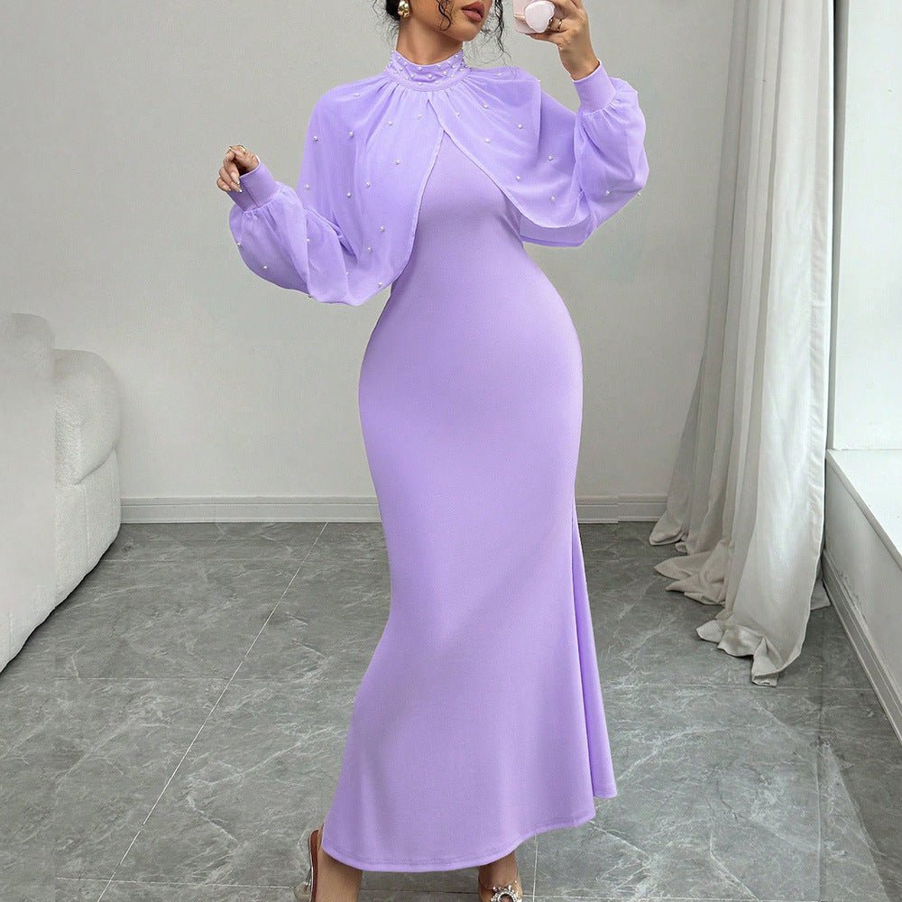 Pearl-beaded cuff and fitted sleeve end of sheer bishop sleeve gown