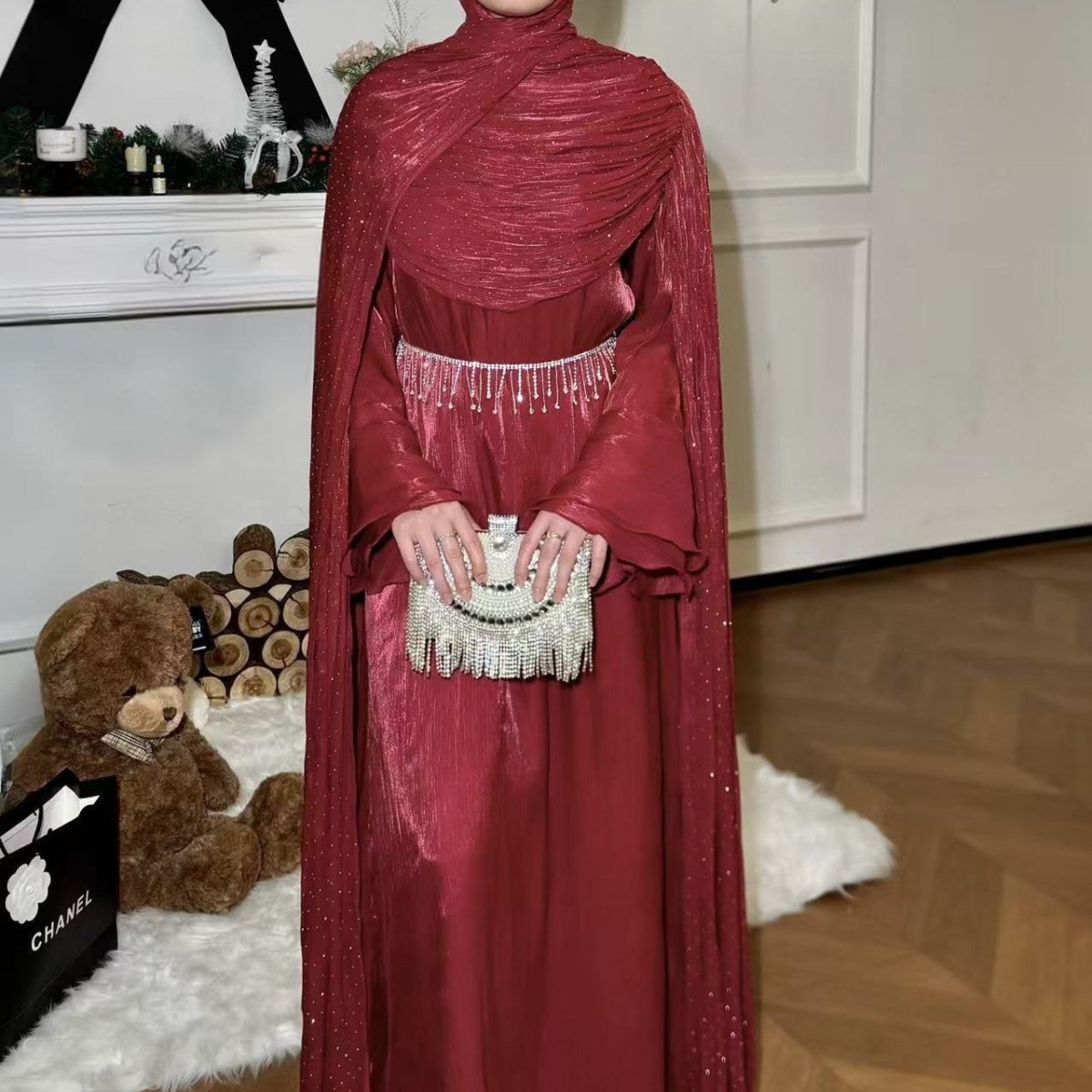 Flowing cape panels in motion on pleated occasion abaya