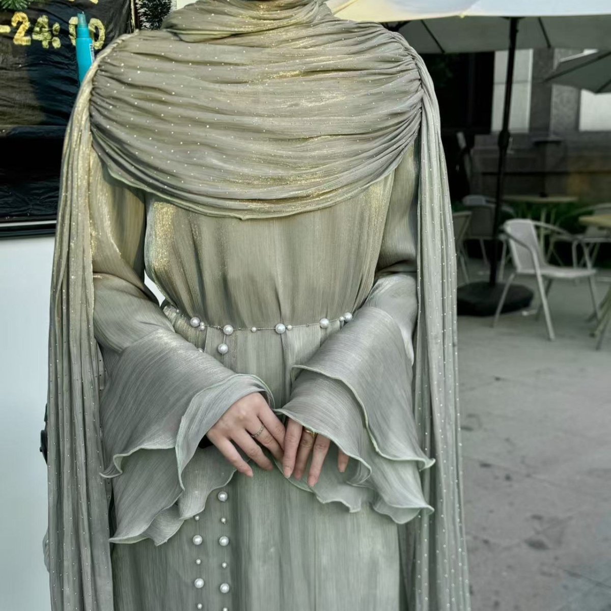 Side view of A-line skirt on rhinestone silk maxi abaya