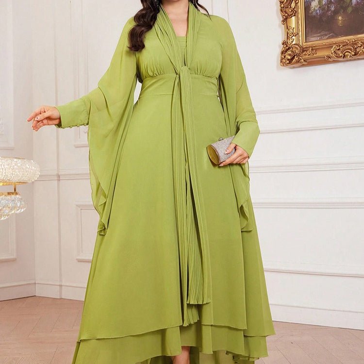 Back view of plus size pleated maxi dress showing tiered hem layers