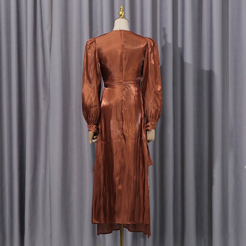 Front view of copper bronze satin maxi dress with twisted bow waist detail