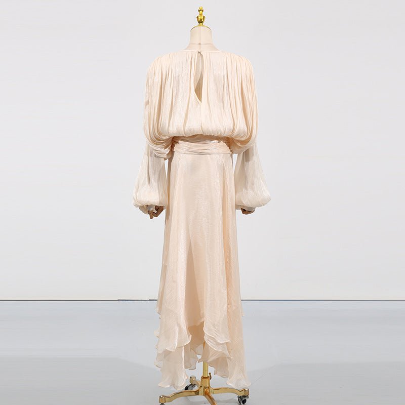 Back view of satin tie-neck blouson dress with flowing asymmetric ruffle hem