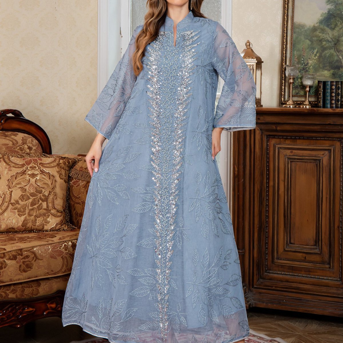 Sequin embroidered mesh gown with intricate embellishment and modest cut