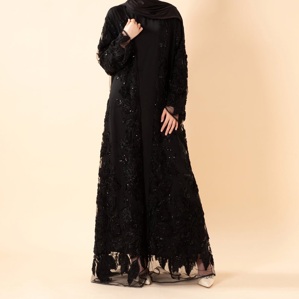 Full-length view of sheer illusion mesh abaya with sculpted floral design