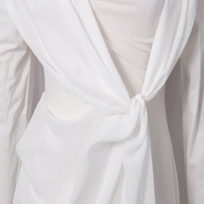 Close-up of high round neckline and asymmetric draping