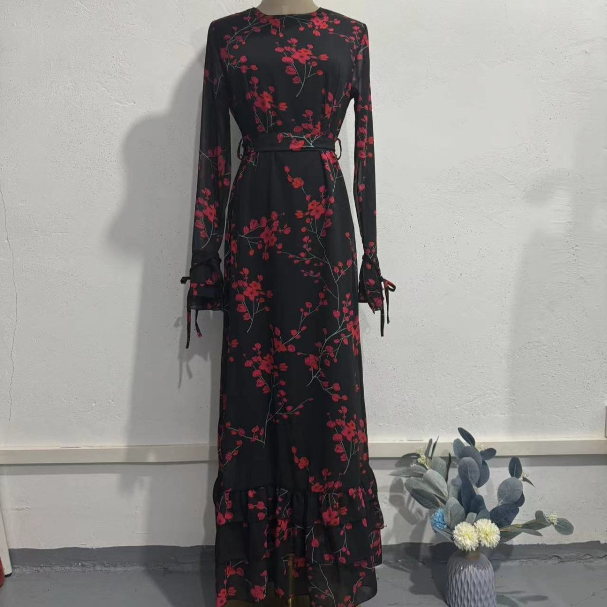 Mermaid skirt and ruffle hem detail of vintage floral bodycon dress