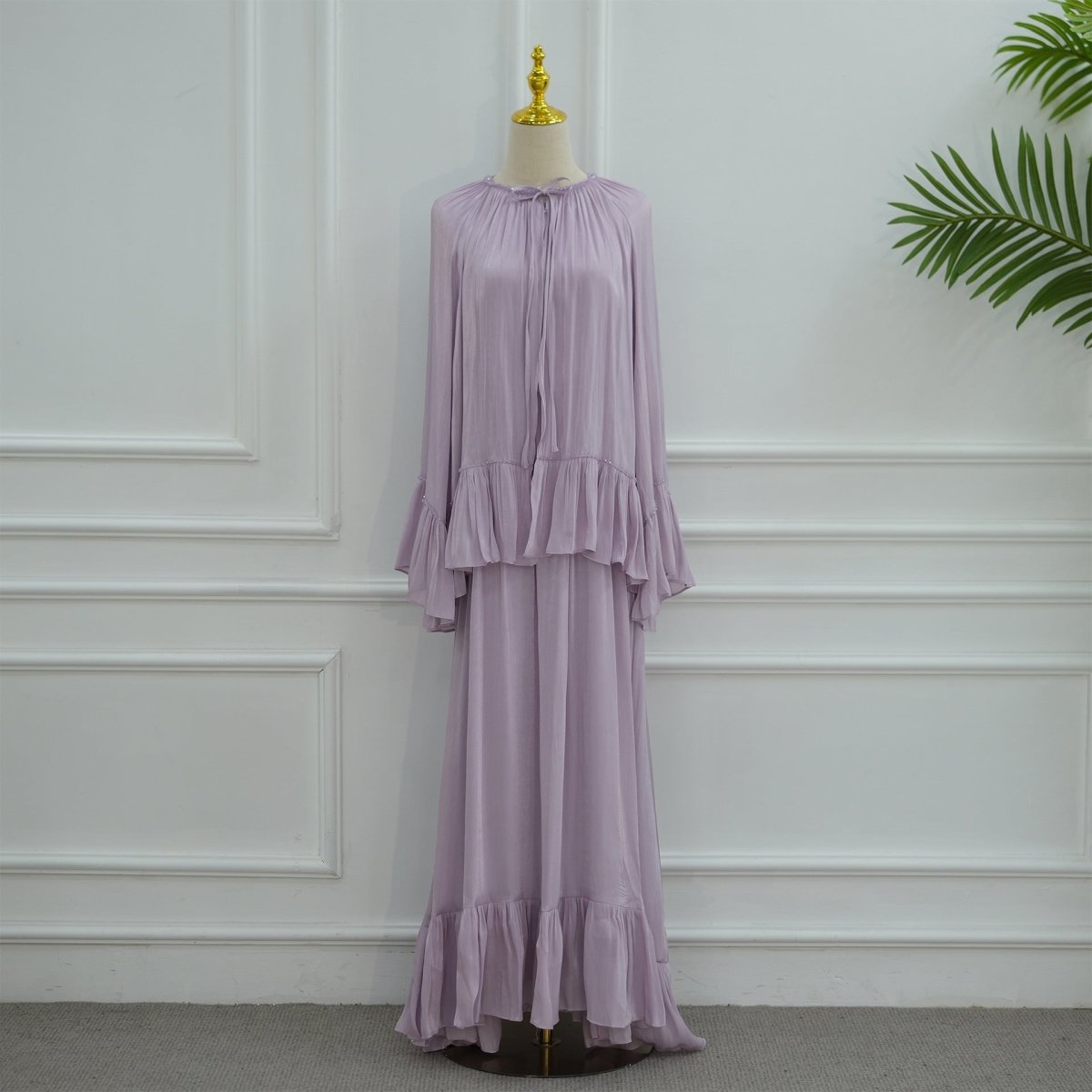 Model wearing the complete 2-piece crystal ruffle abaya set at an elegant event