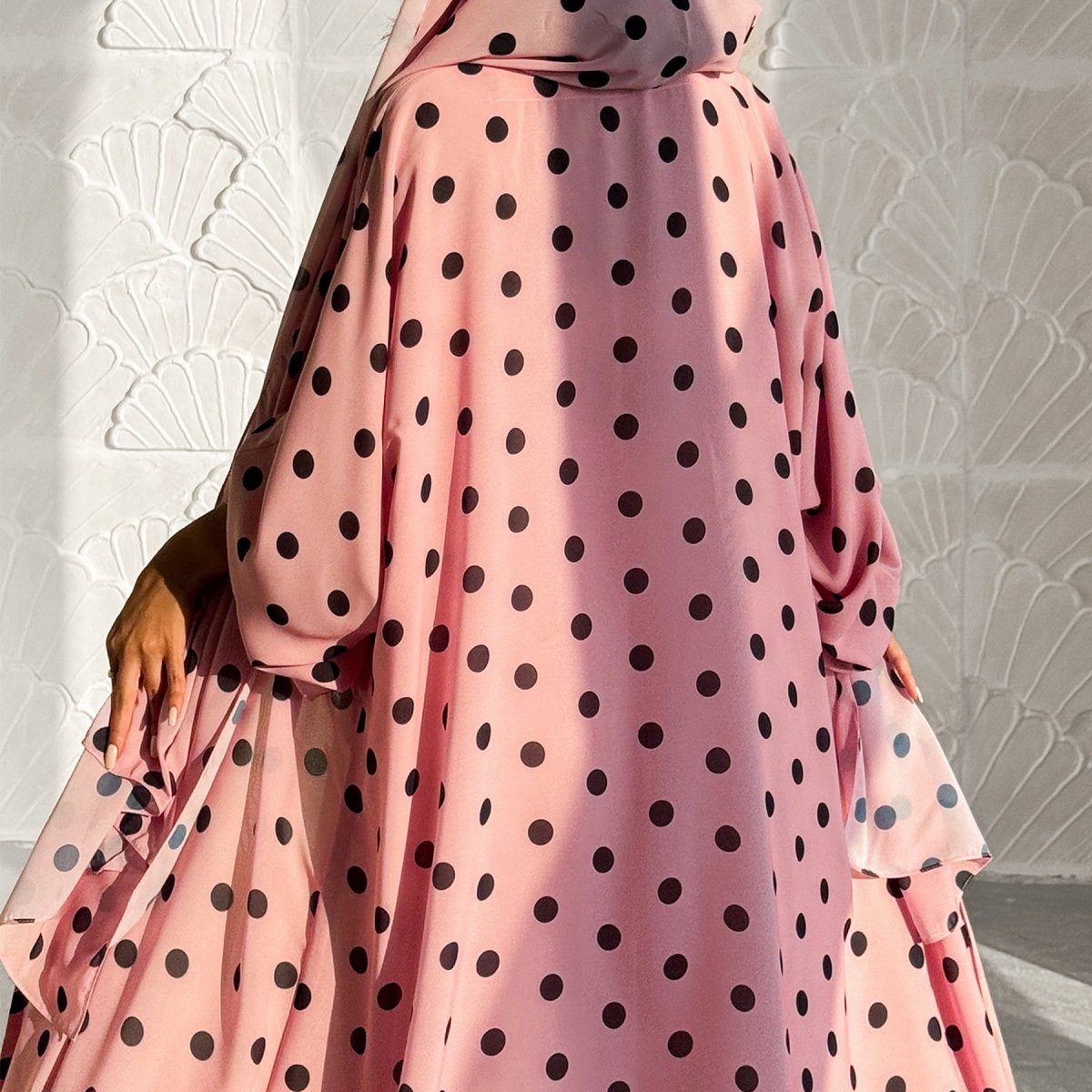 Flowing batwing sleeve detail on ice-silk crepe polka dot abaya