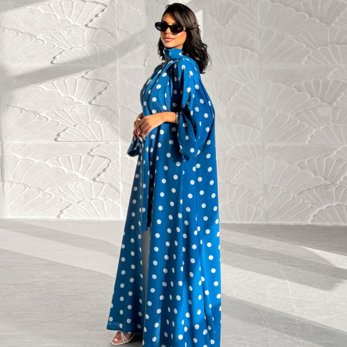 Model wearing polka dot 2-piece abaya set in full-length shot