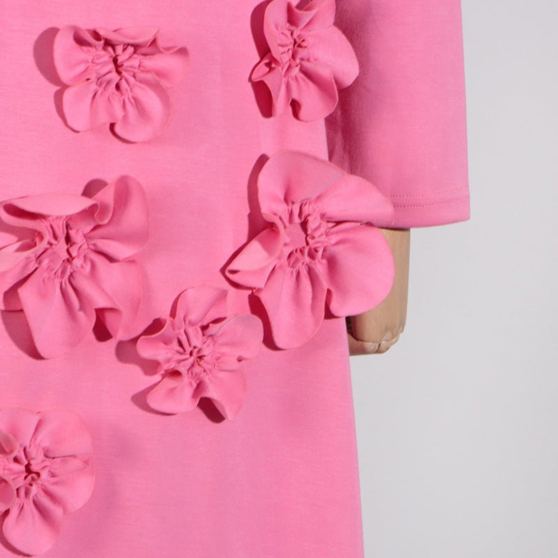 Fitted silhouette of 3D floral maxi dress showing A-line skirt flow
