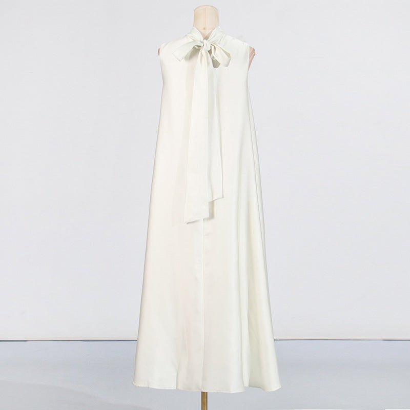Back view of white bridal maxi dress with tie-bow neck closure