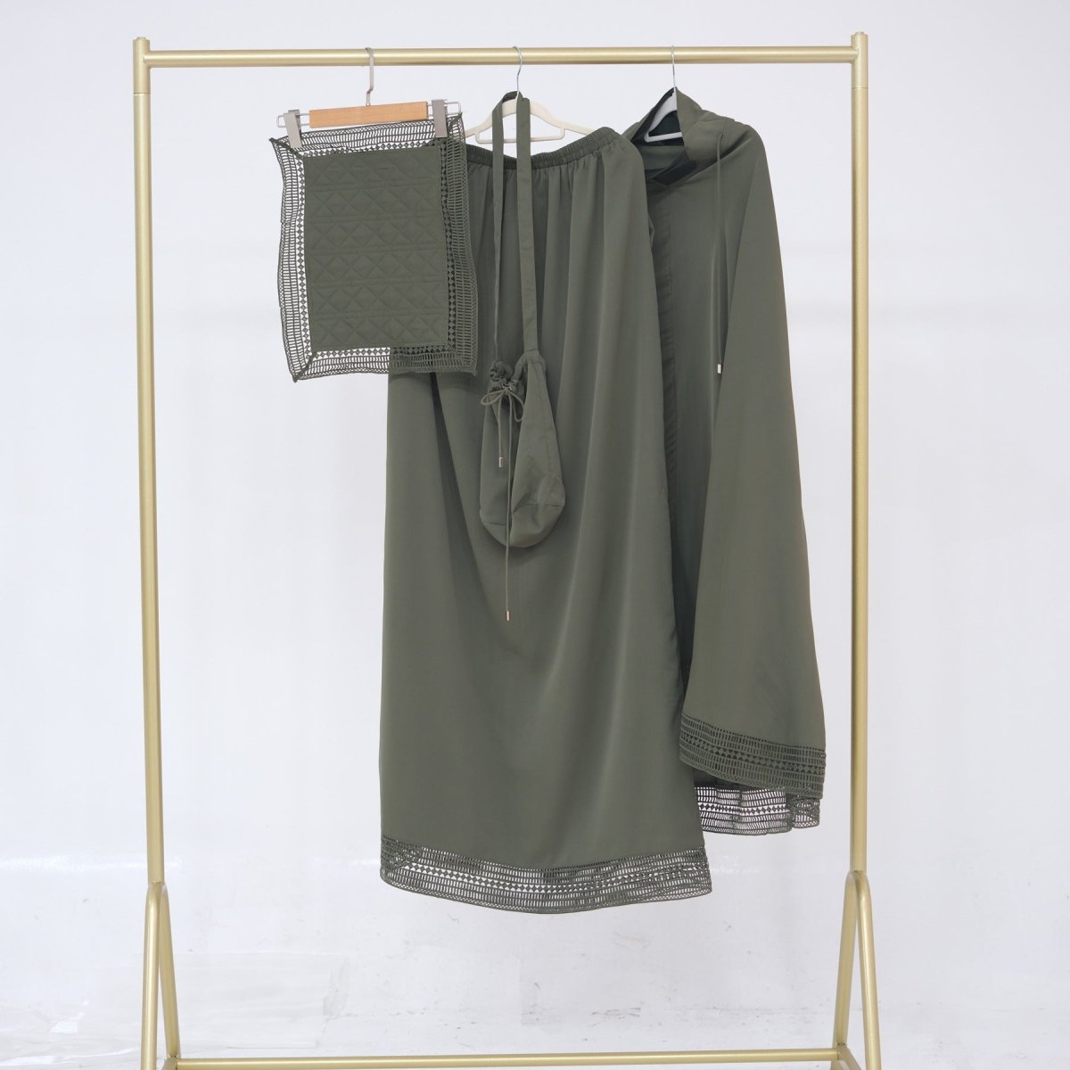 Hooded prayer dress shown from front with lace hem detail
