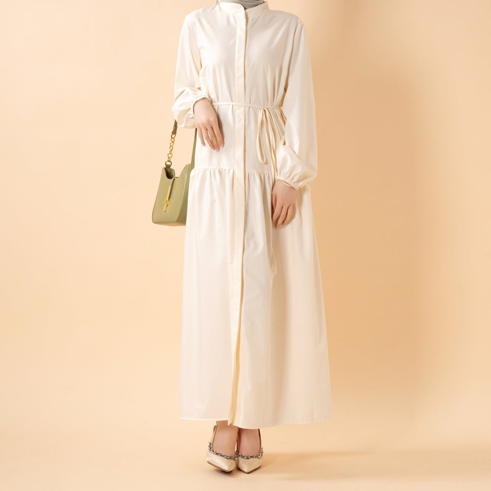 Trench-inspired collar and button placket close-up on modest maxi dress