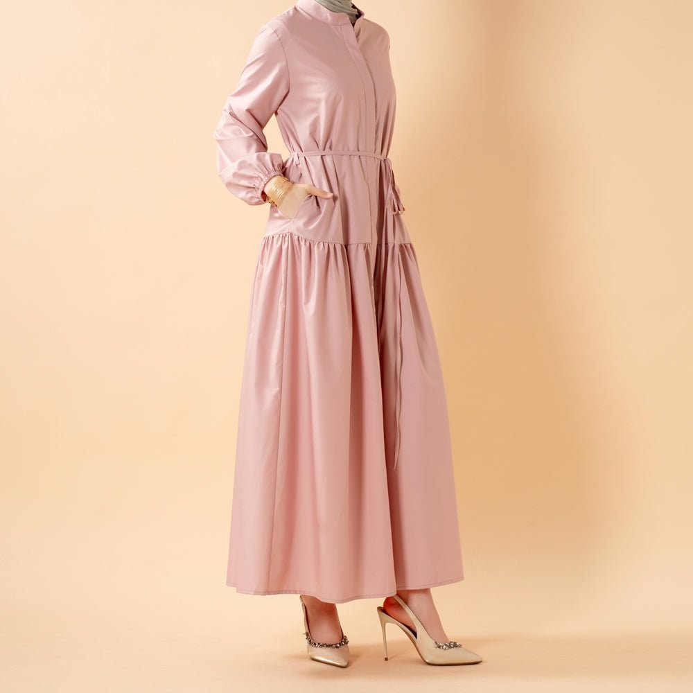 Close-up of wudu-friendly elastic cuffs on trench shirt abaya