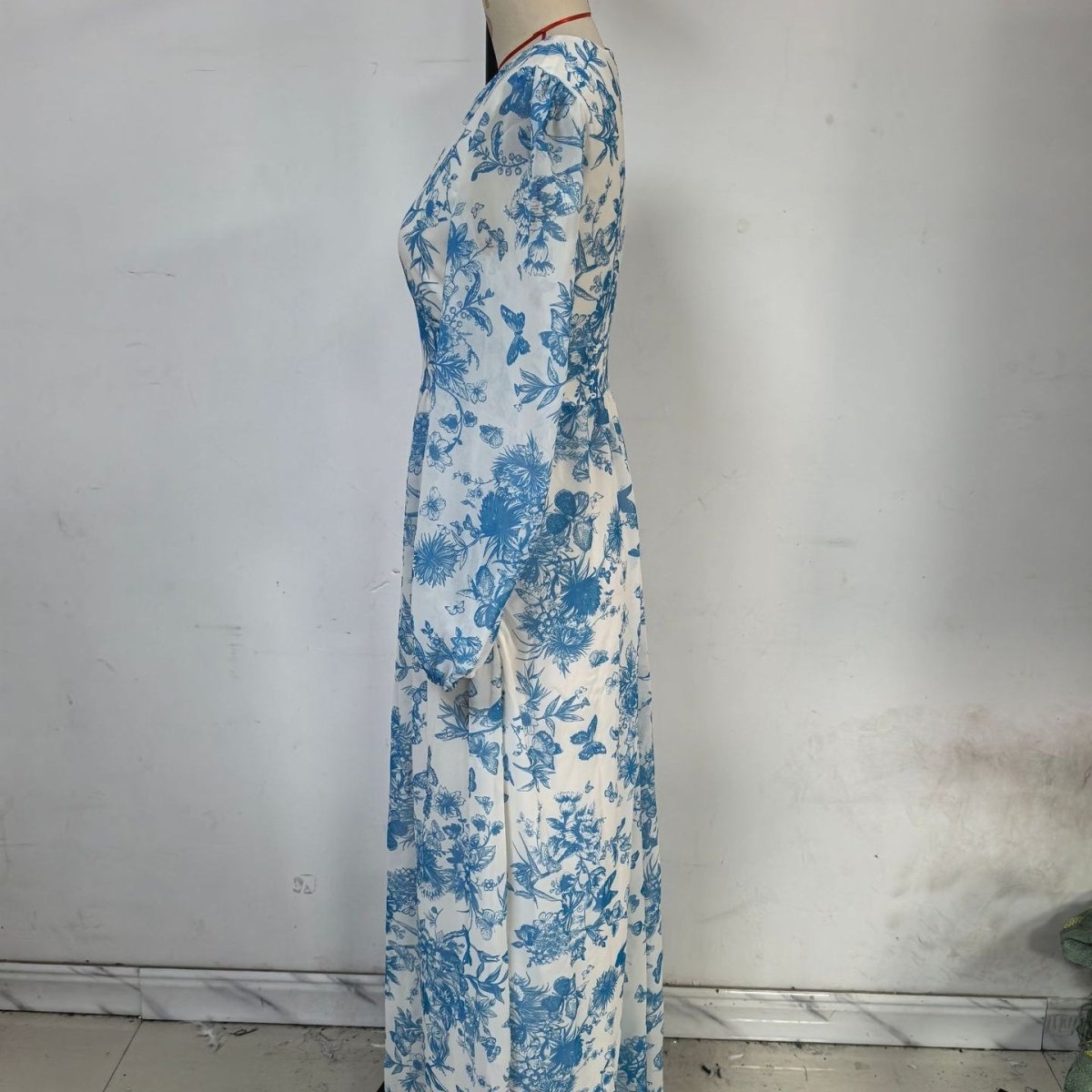 Modest floral maxi dress with elegant neckline and flowing hemline