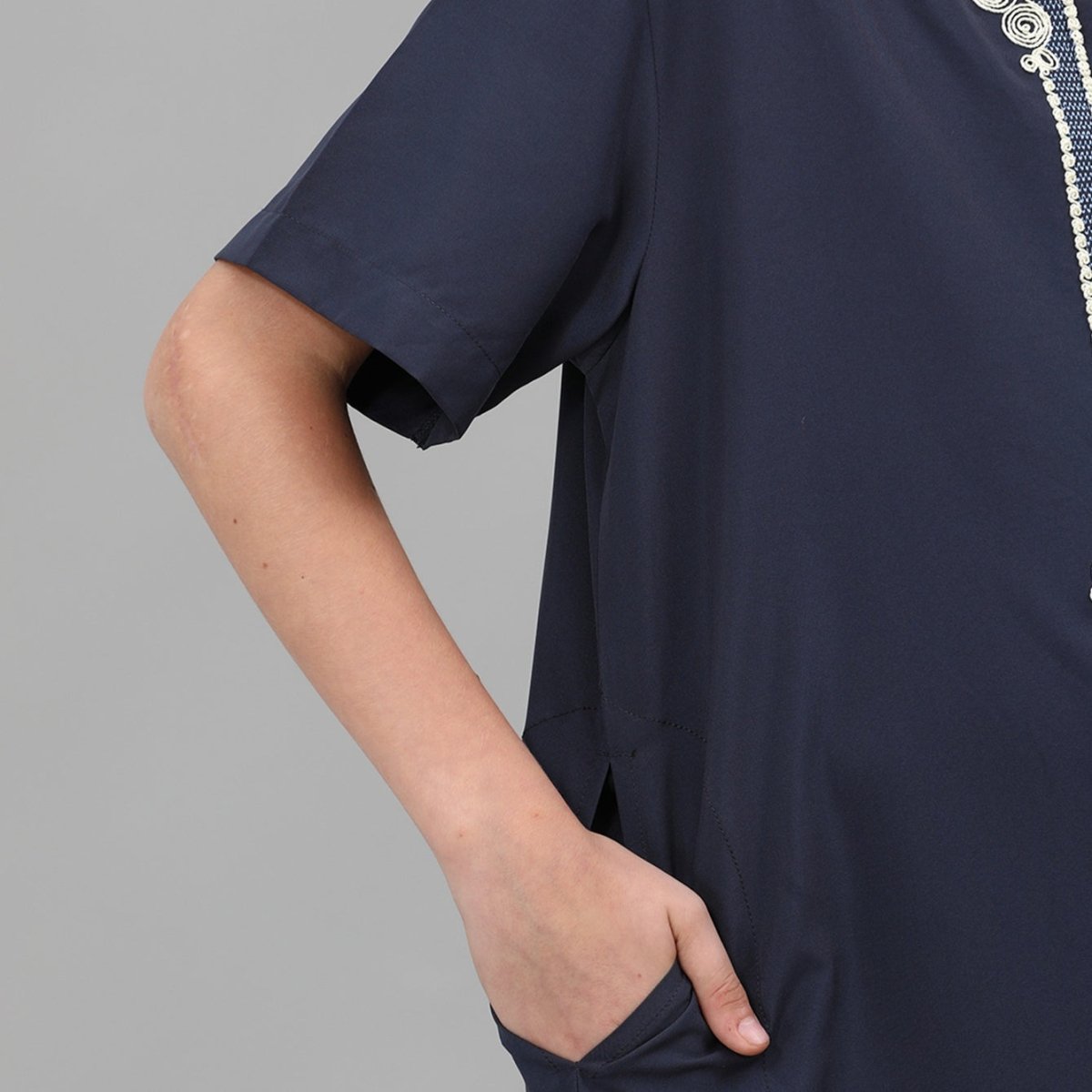 Short sleeve detail of poly-cotton boys ornate thobe