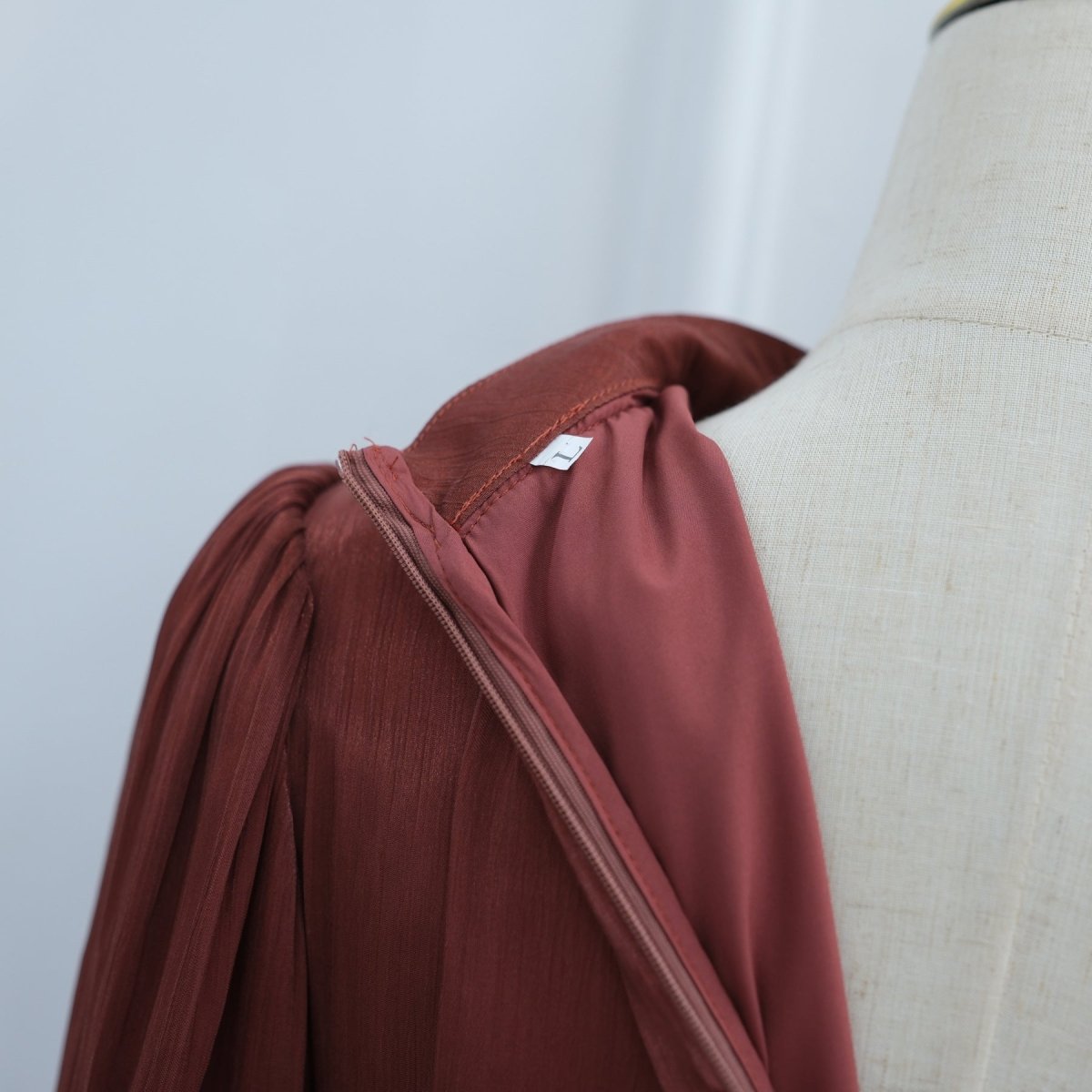 Voluminous lantern sleeve gathered at the cuff