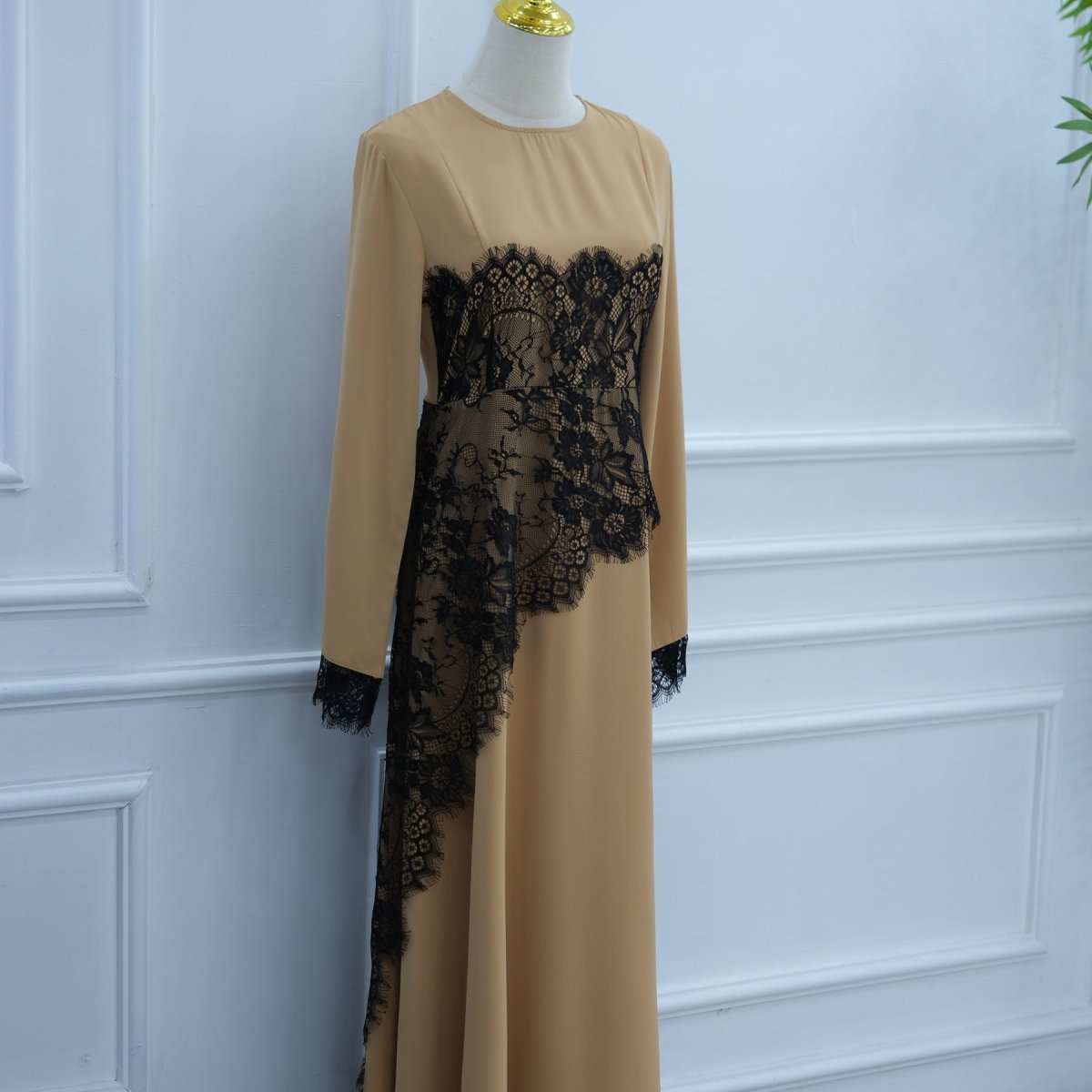 Side profile of diagonal lace waist panel creating optical cinching effect